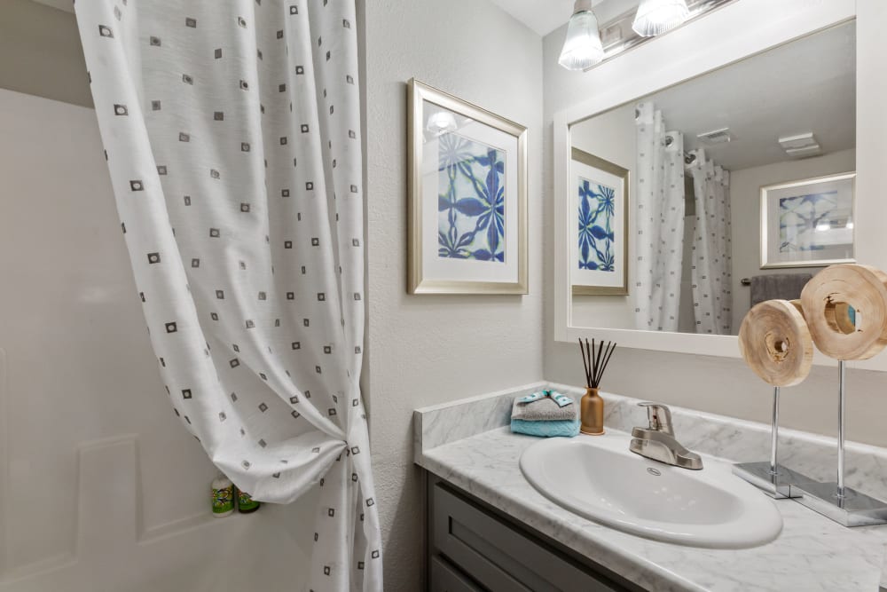 Bathroom with white countertops at 505 West Apartment Homes in Tempe, Arizona