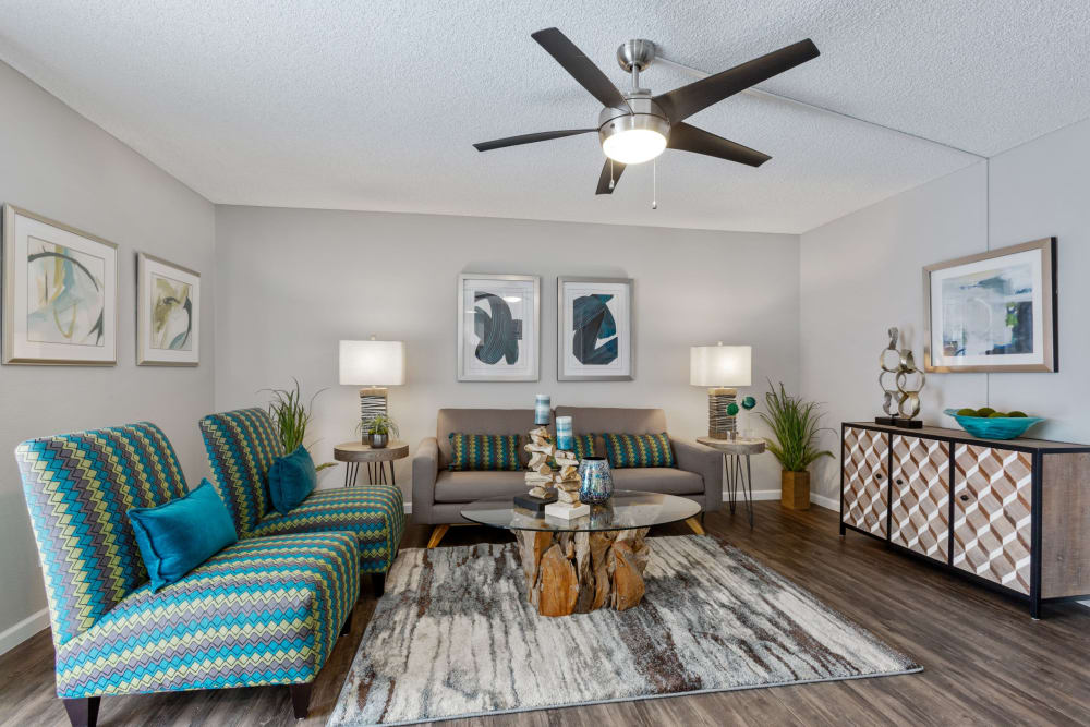 Model living room with a ceiling fan at 505 West Apartment Homes in Tempe, Arizona