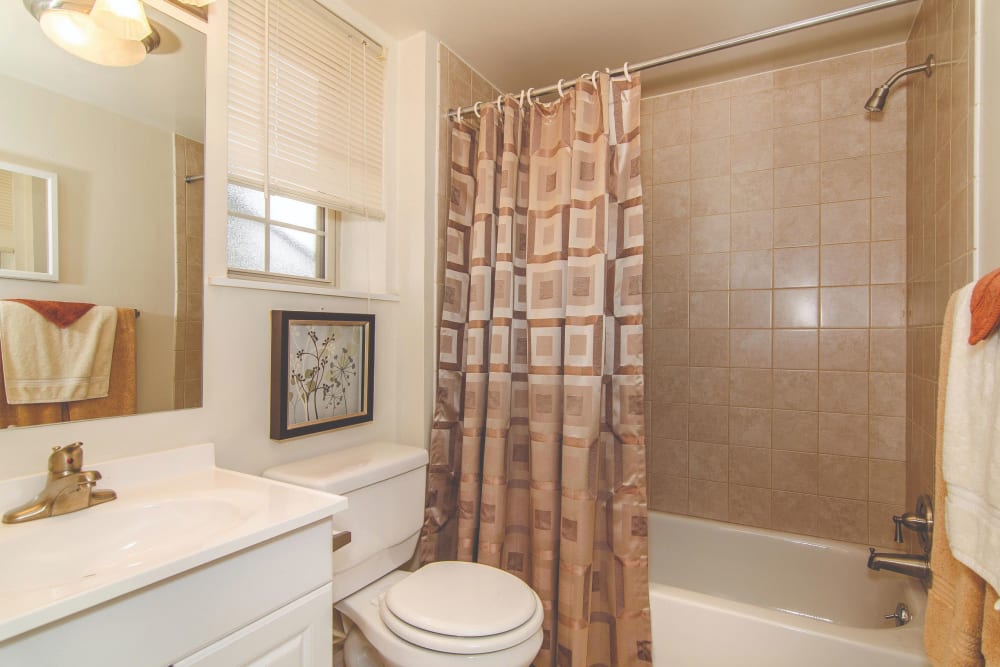 Bathroom with a shower tub at Ridley Brook Apartments in Folsom, Pennsylvania