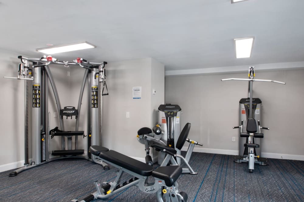 Cable machines in the fitness center at Ridley Brook Apartments in Folsom, Pennsylvania