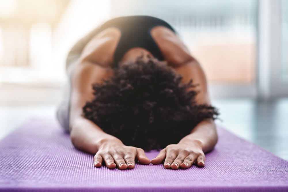 Doing yoga at Parkway Apartment Homes in Fremont, California