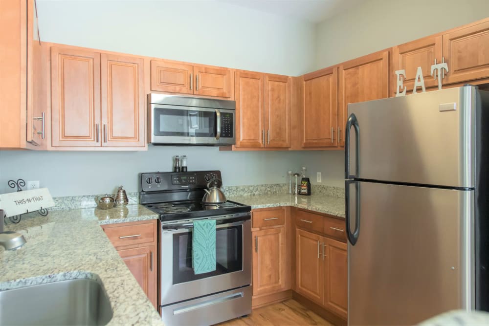 Custom cabinetry in a model apartment's kitchen at Eagle Rock Apartments at Fishkill in Fishkill, New York