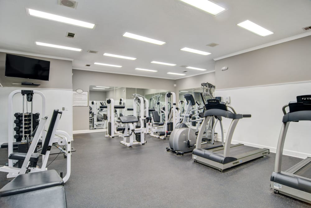 Well equipped fitness center at Amber Chase Apartment Homes in McDonough, Georgia