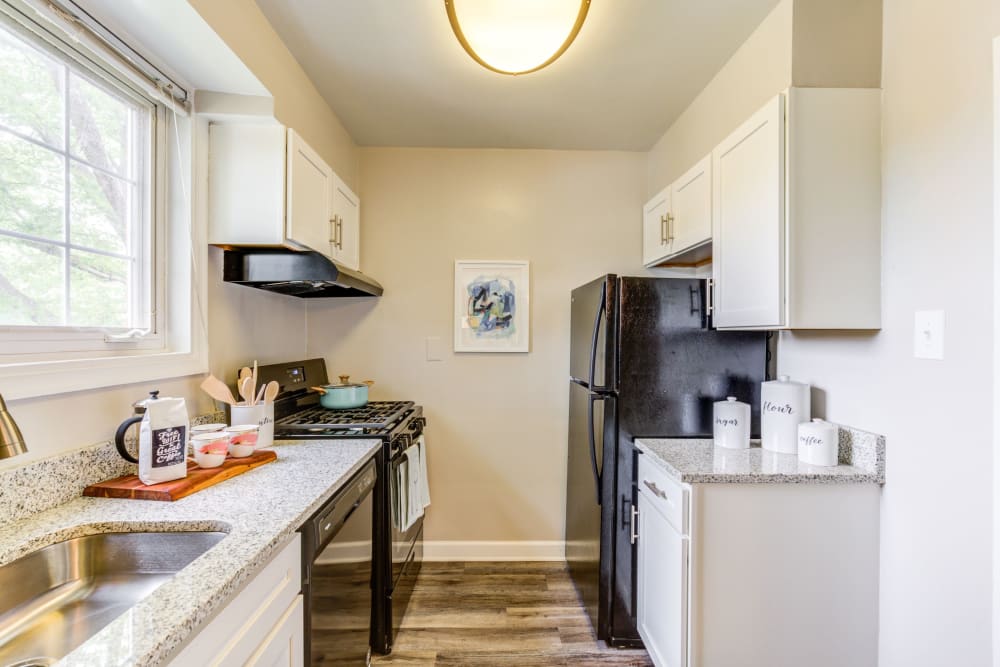 Kitchen with white cabinets at Braddock Lee Apartments in Alexandria, Virginia