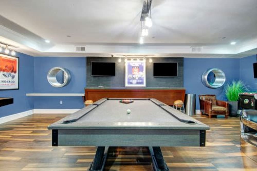 Pool table and TVs in clubhouse at Bradlee Danvers in Danvers, Massachusetts