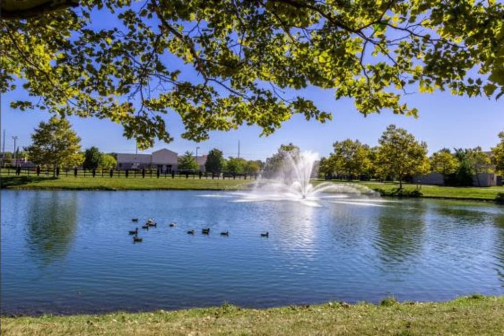 Large pond with the fountain adjacent to building at Heritage Green in Hilliard, Ohio