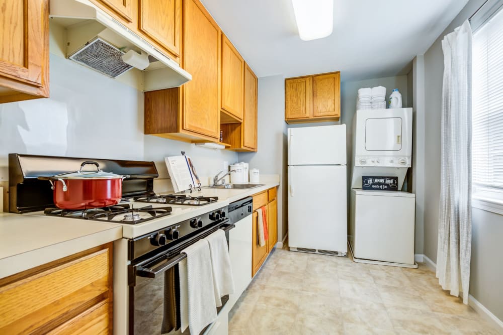 Kitchen with white appliances at Howard Crossing in Ellicott City, Maryland
