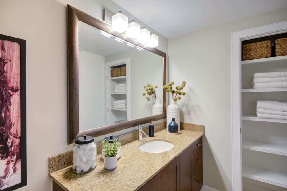 Clean bathroom with nice large vanity mirror at Sofi 55 Hundred in Arlington, Virginia