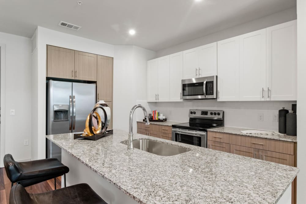 Kitchen with granite countertops at 32Hundred Windsor in Denton, Texas