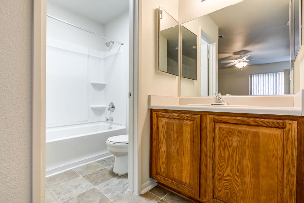 A bathroom with separated areas in a home at Carl Vinson Park in Lemoore, California