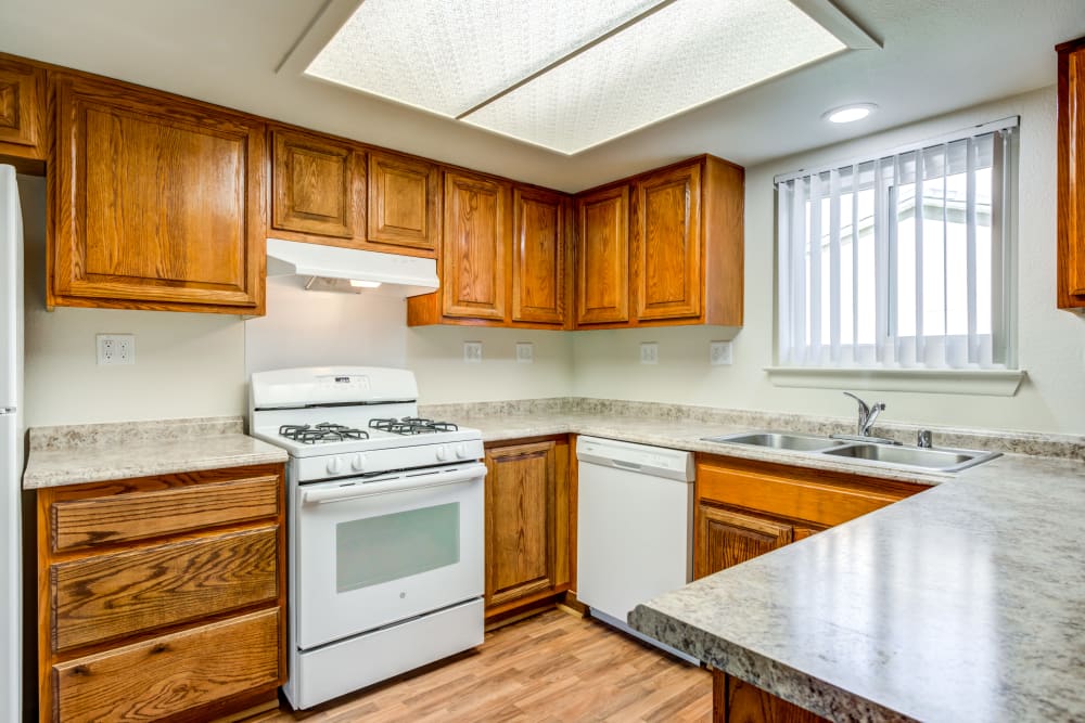 A kitchen with appliances in a home at Carl Vinson Park in Lemoore, California