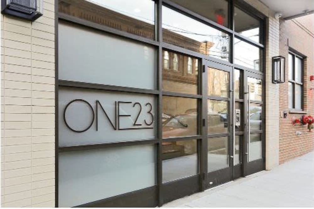 Front entrance sign at ONE23 Apartments in Union City, New Jersey