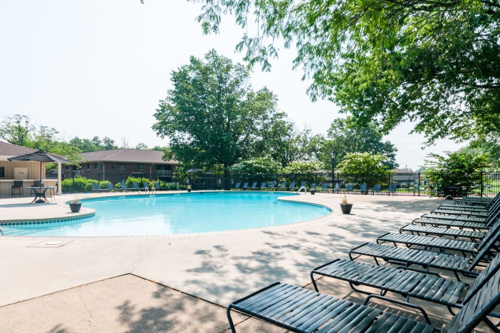 Lounge chairs poolside at Racquet Club Apartments and Townhomes in Levittown, Pennsylvania