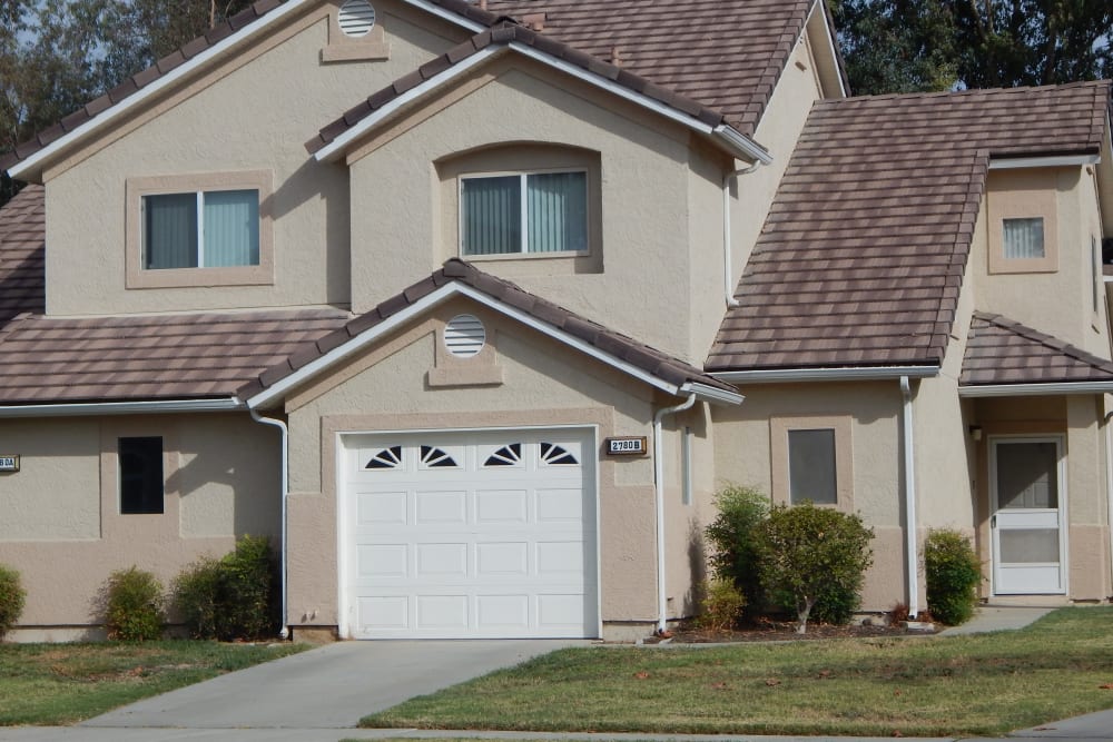 Exterior view of a home with a garage at Midway Park in Lemoore, California
