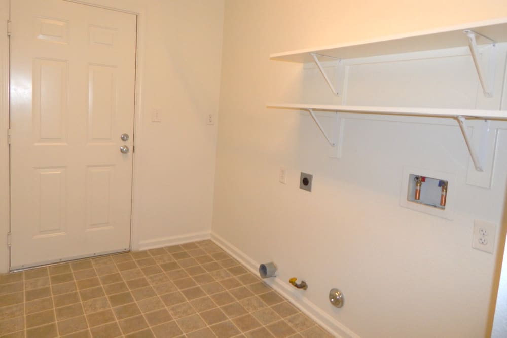 Laundry area with washer and dryer hookups in a home at Midway Park in Lemoore, California