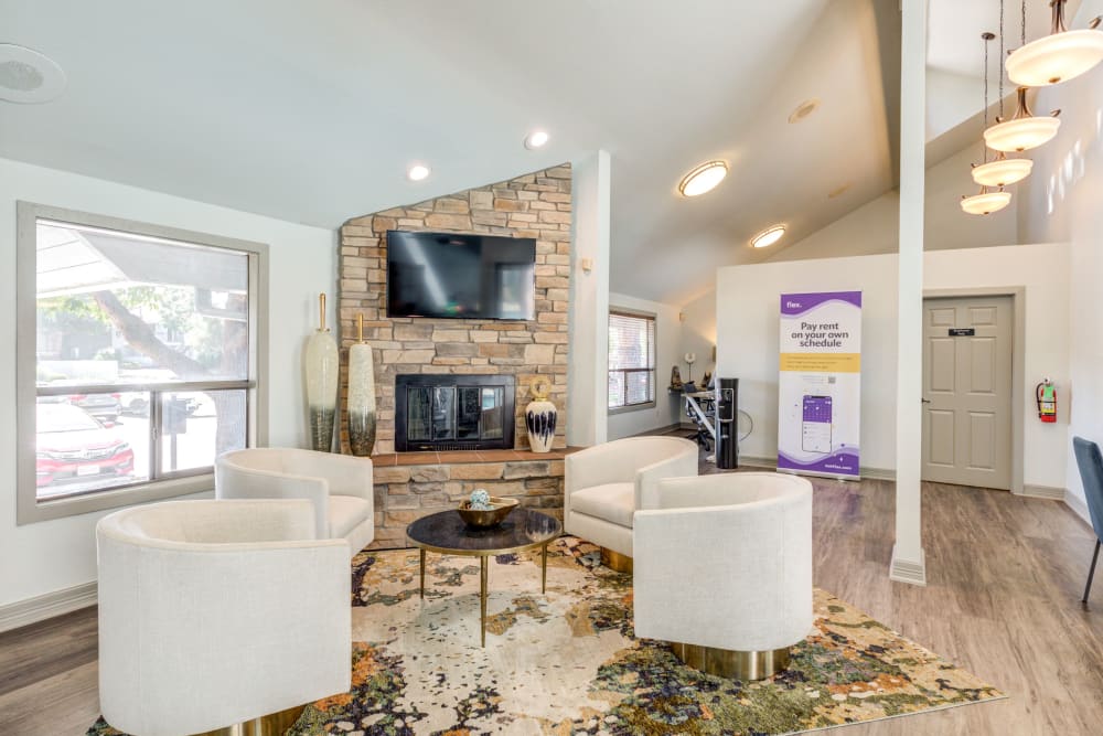 Clubhouse lounge with TV and fireplace at Santana Ridge in Denver, Colorado