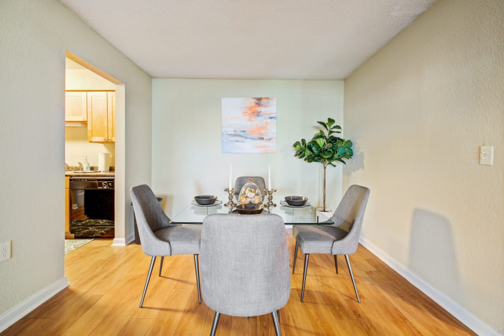 Dining nook with laminate wood floors at Signal Pointe Apartment Homes in Winter Park, Florida