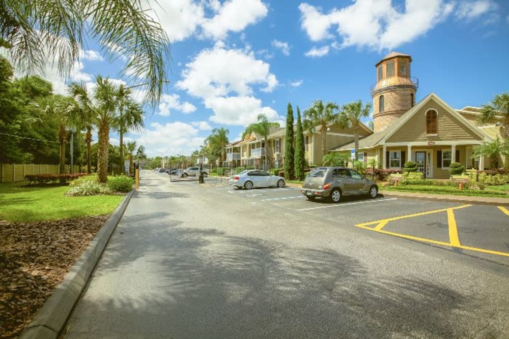 Parking lot in front of main office at Signal Pointe Apartment Homes in Winter Park, Florida
