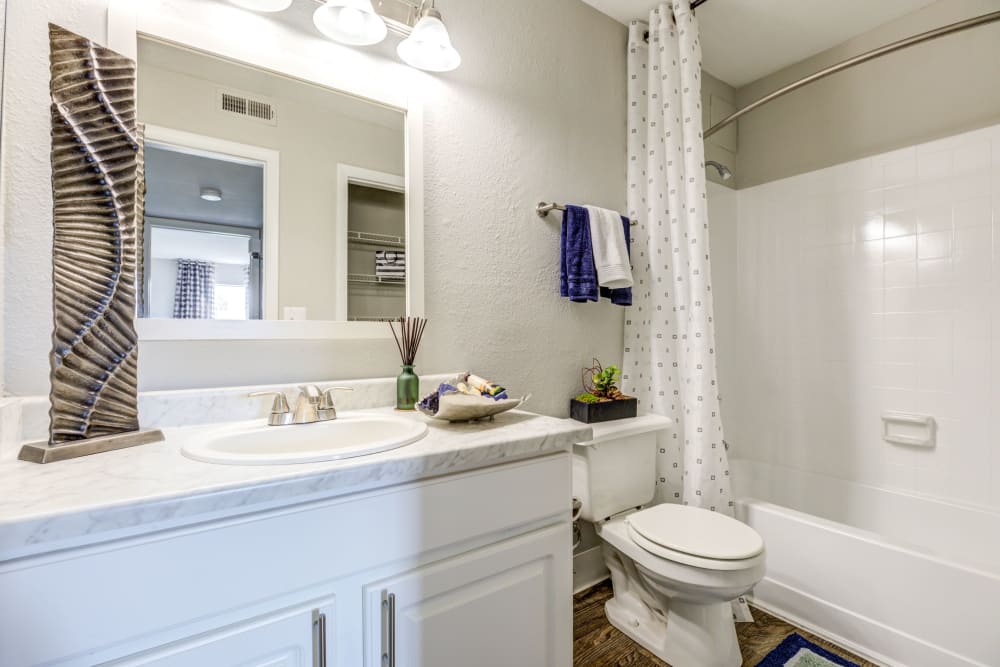 Bathroom with white cabinetry at Skyline in Thornton, Colorado