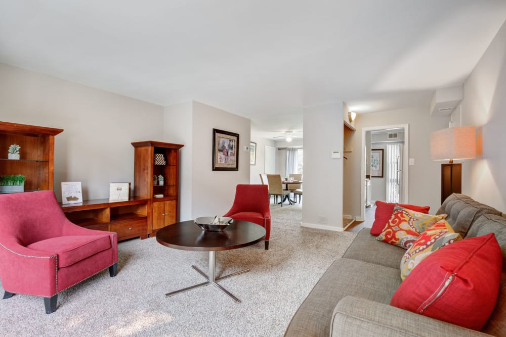 Living room with red furniture at Westchester West in Silver Spring, Maryland