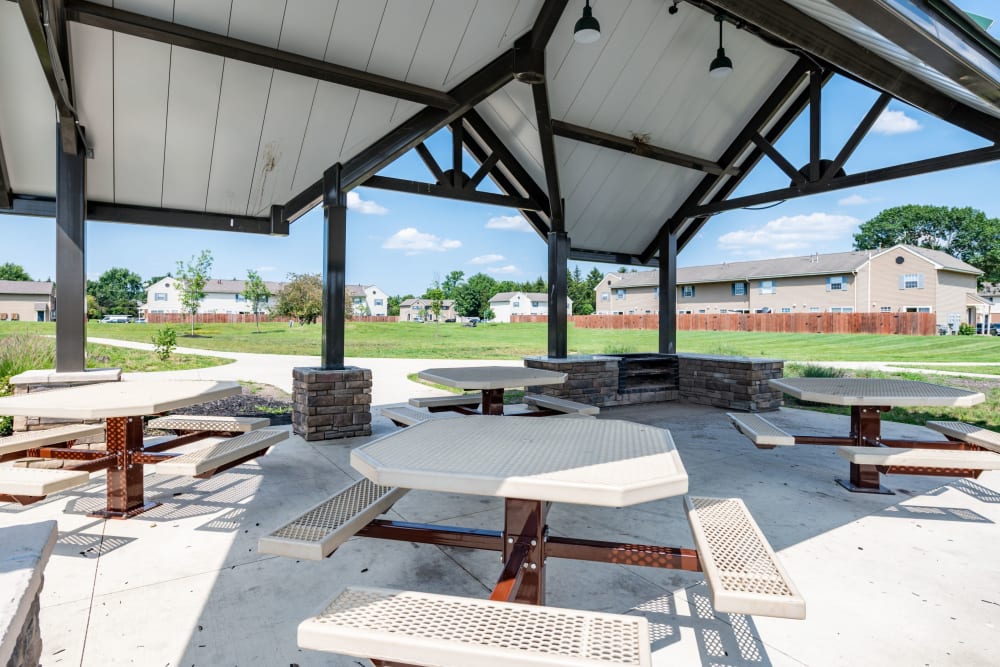Picnic tables under outdoor awning at Worthington Meadows in Columbus, Ohio