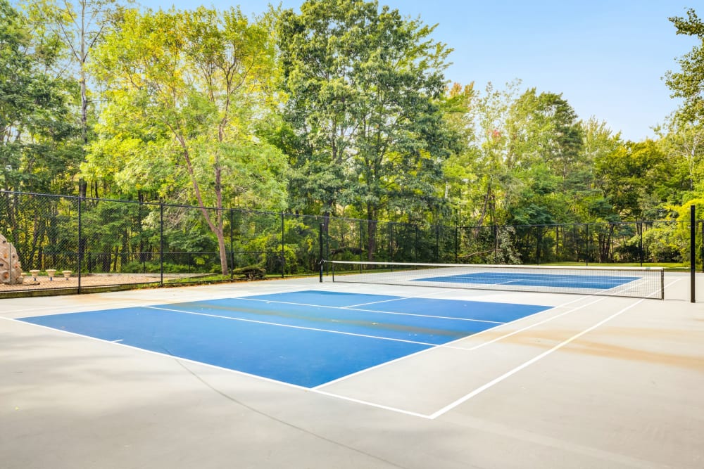Outdoor tennis courts at The Commons At Haynes Farm in Shrewsbury, Massachusetts