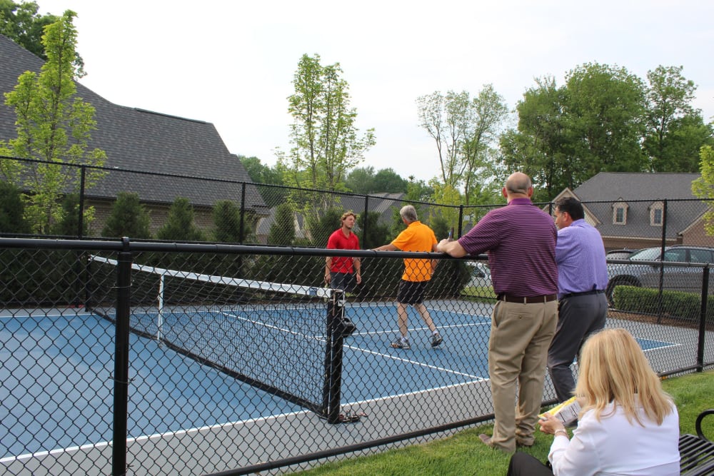 Residents playing tennis at Blossom Ridge in Oakland Charter Township, Michigan