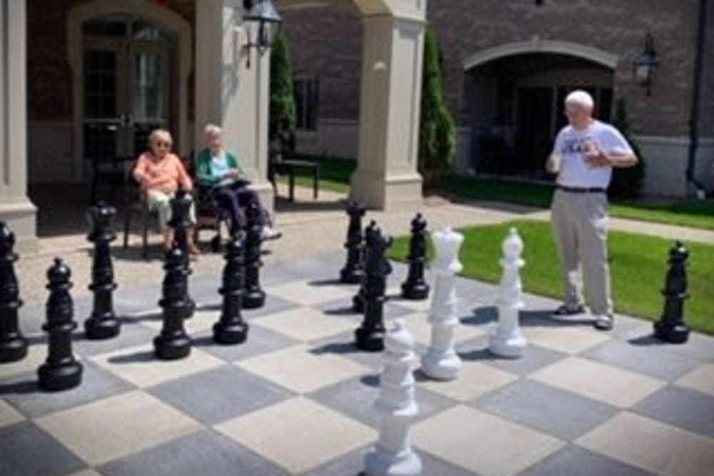 Residents playing giant chess at Blossom Ridge in Oakland Charter Township, Michigan