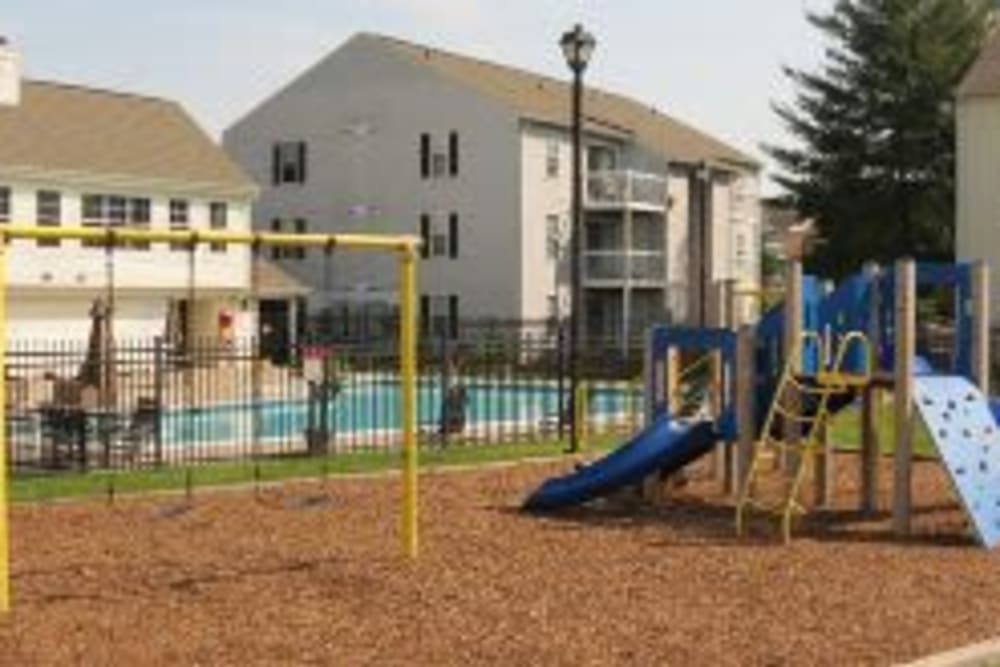 Outdoor playground near pool at The Landings I & II Apartments in Alexandria, Virginia
