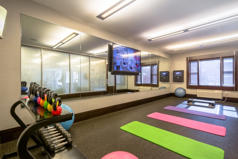 Open space in gym with yoga mats at 55 Riverwalk Place in West New York, New Jersey