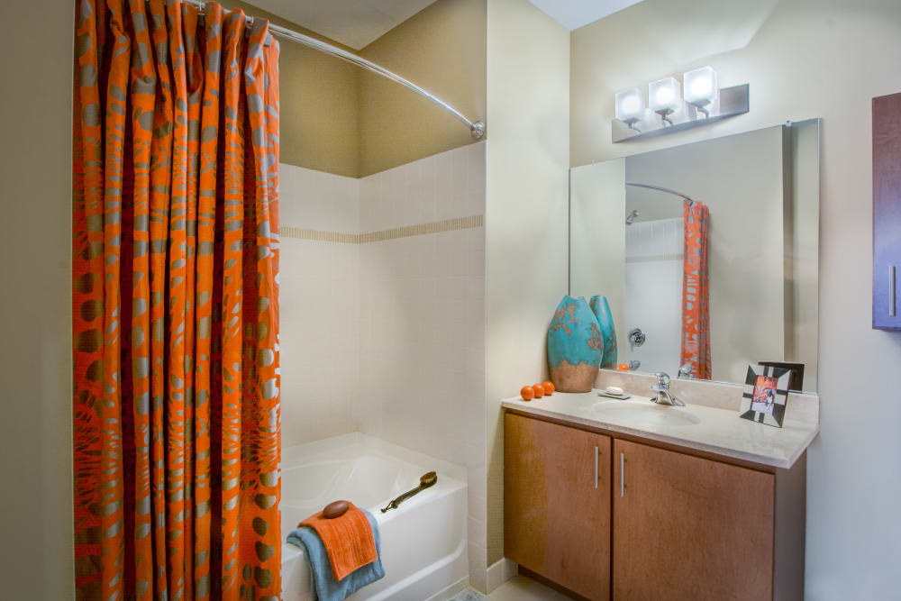 Model bathroom with shower and bathtub at 55 Riverwalk Place in West New York, New Jersey