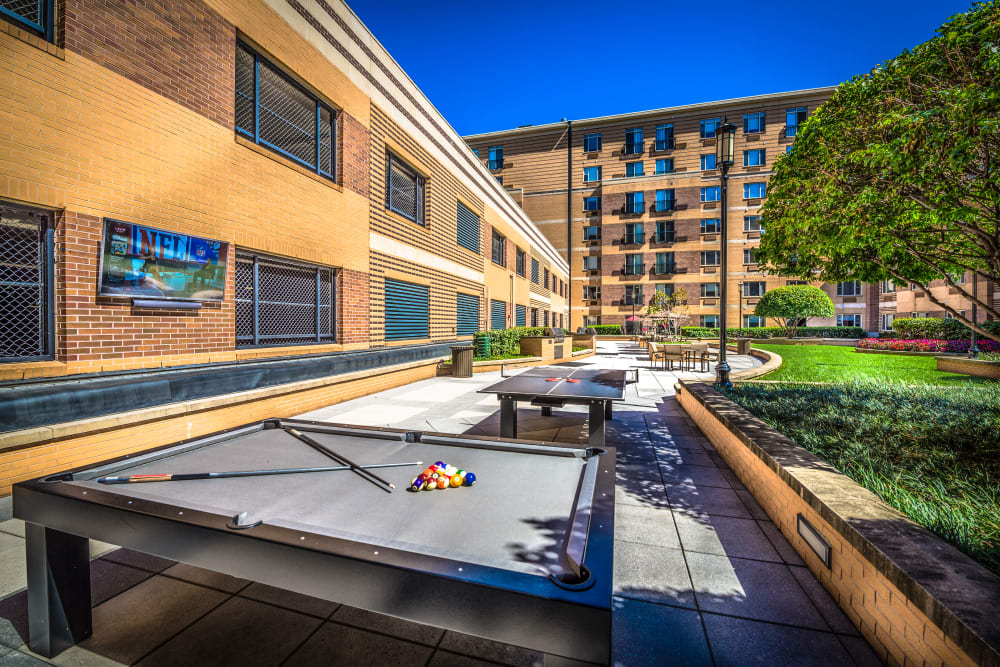 Community pool tables on the patio at 55 Riverwalk Place in West New York, New Jersey