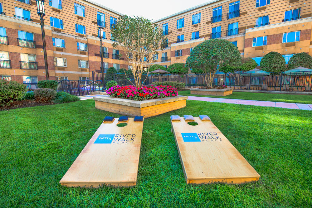 Cornhole set up on the lawn at 55 Riverwalk Place in West New York, New Jersey