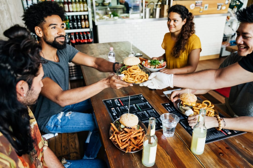 Resident friends out for a bite to eat at their favorite spot near Anden in Weymouth, Massachusetts