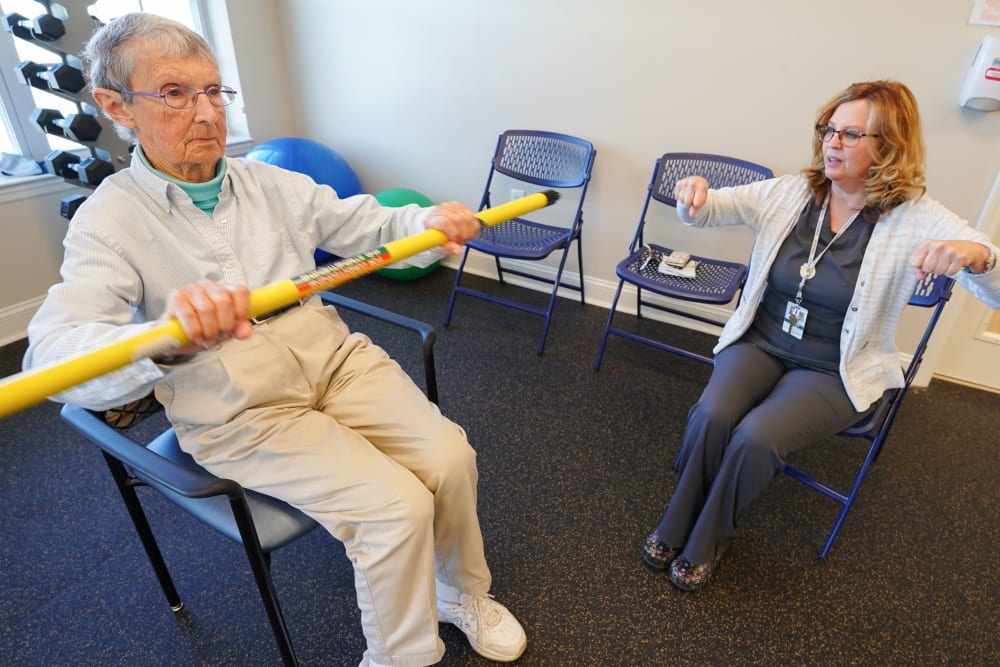 Resident exercising with nurse at Harmony at State College in State College, Pennsylvania
