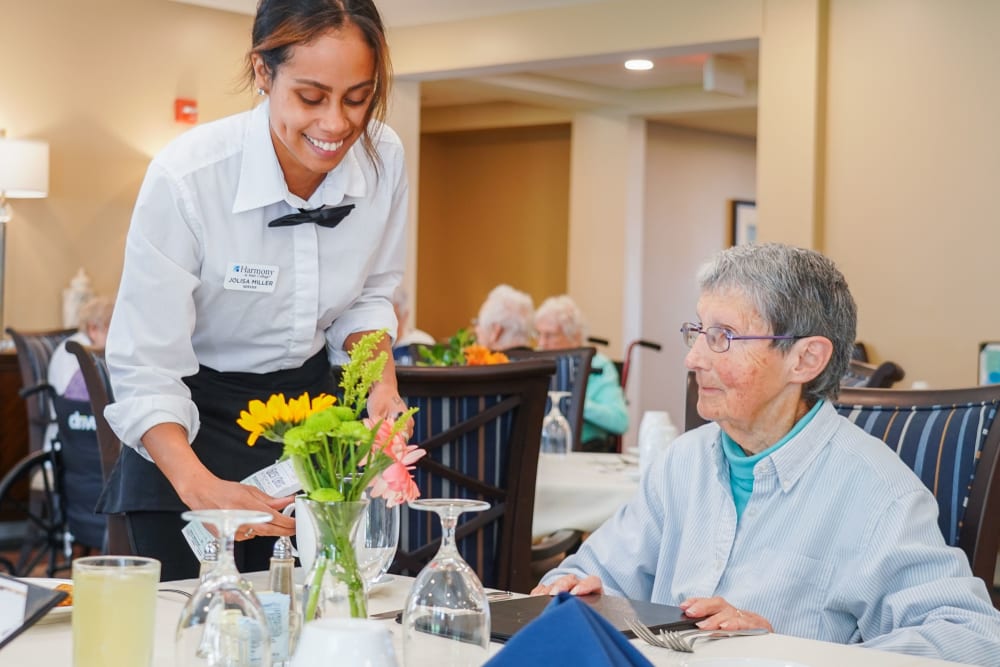 Resident being served meal at Harmony at State College in State College, Pennsylvania