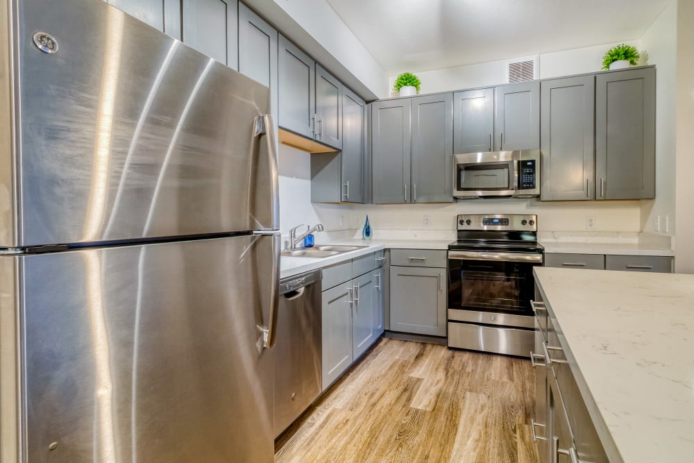 Fully-Equipped Kitchen with stainless-steel appliances at Enchanted Springs Apartments in Colorado Springs, Colorado