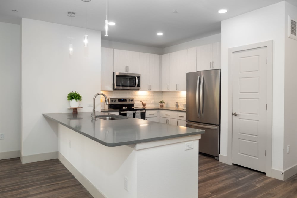 Kitchen with modern features at Marquis at Chandler in Chandler, Arizona