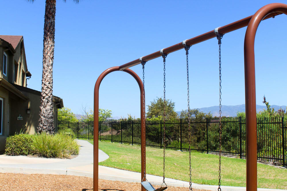 a swingset at Lofgren Terrace in Chula Vista, California