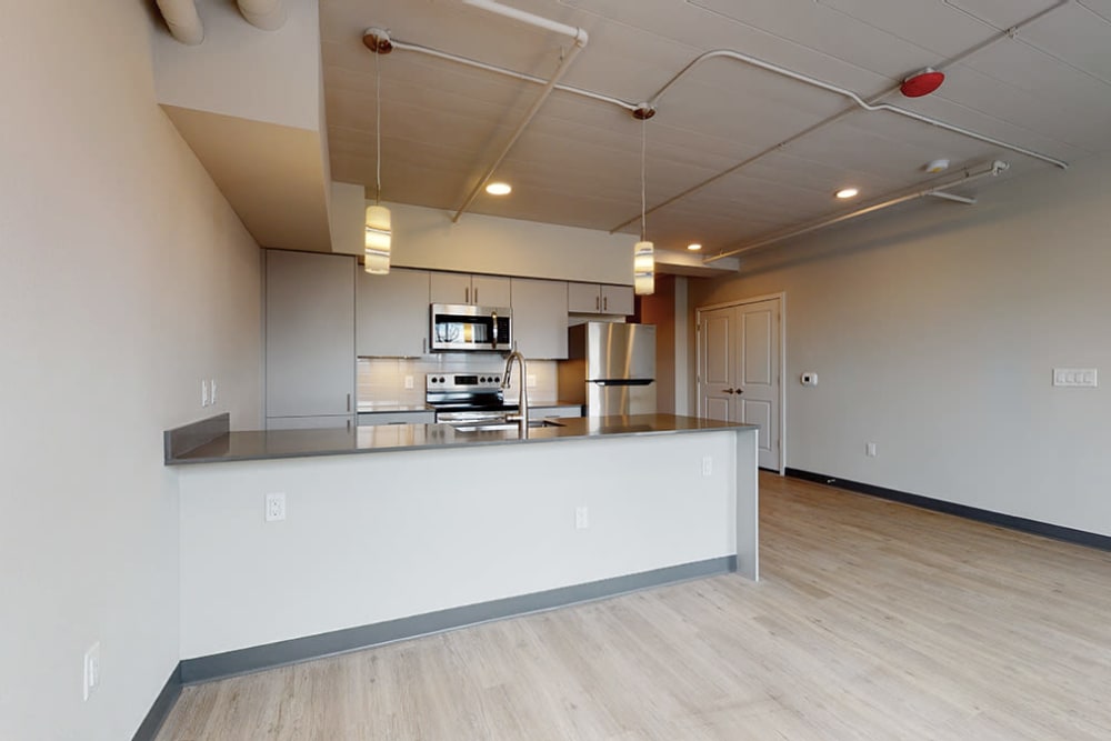 Empty dining and kitchen area at Art District Flats in Denver, Colorado