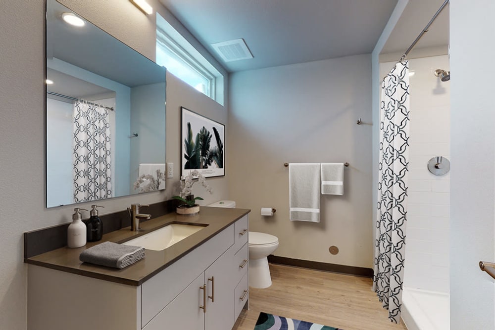 Bathroom with modern features at Art District Flats in Denver, Colorado