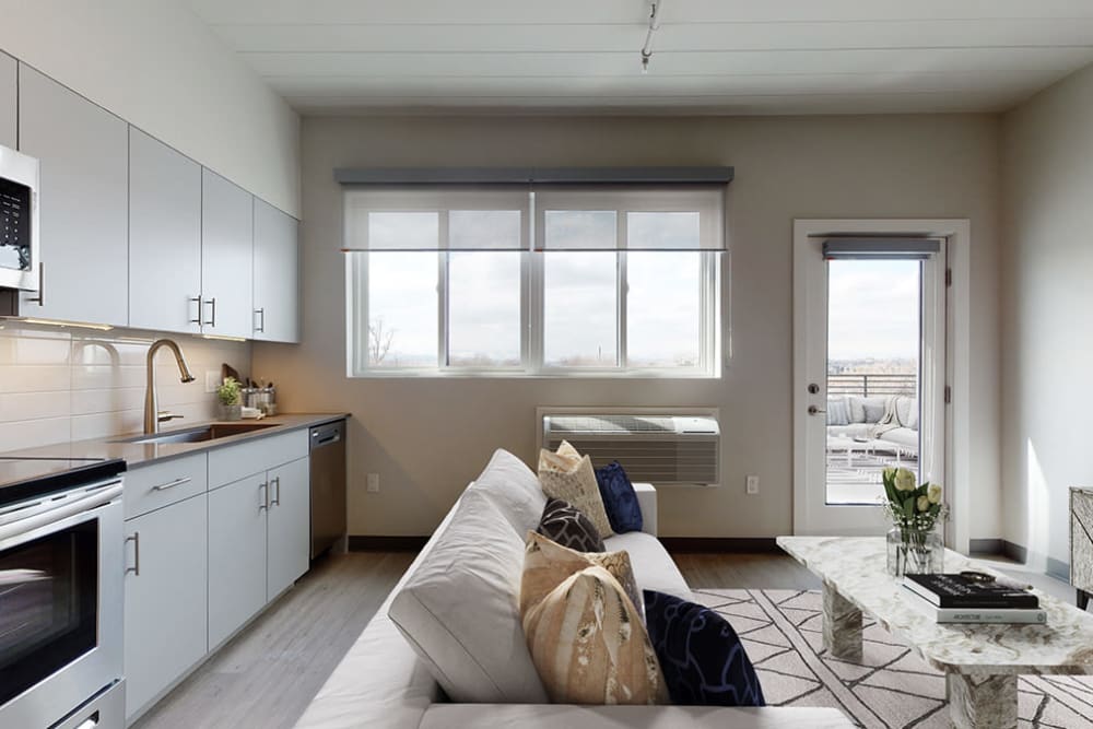 Living room with tons of natural light at Art District Flats in Denver, Colorado