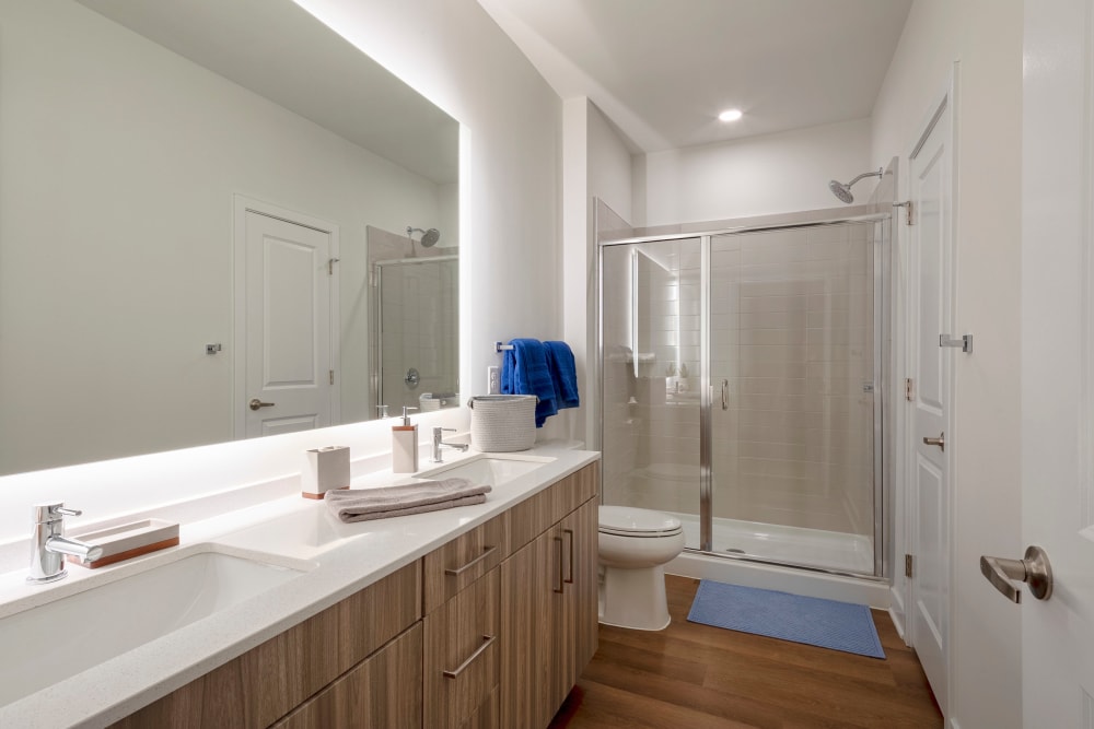 Spacious bathroom with glass shower door at Everly in Largo, Maryland
