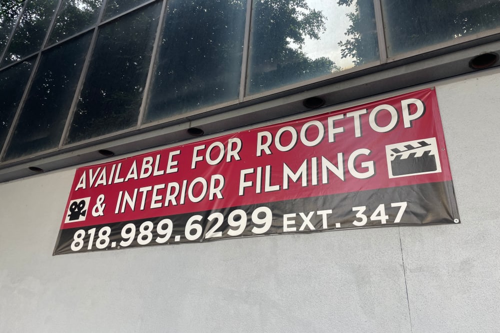 Rooftop filming sign on the side of Los Angeles Self Storage in Los Angeles, California