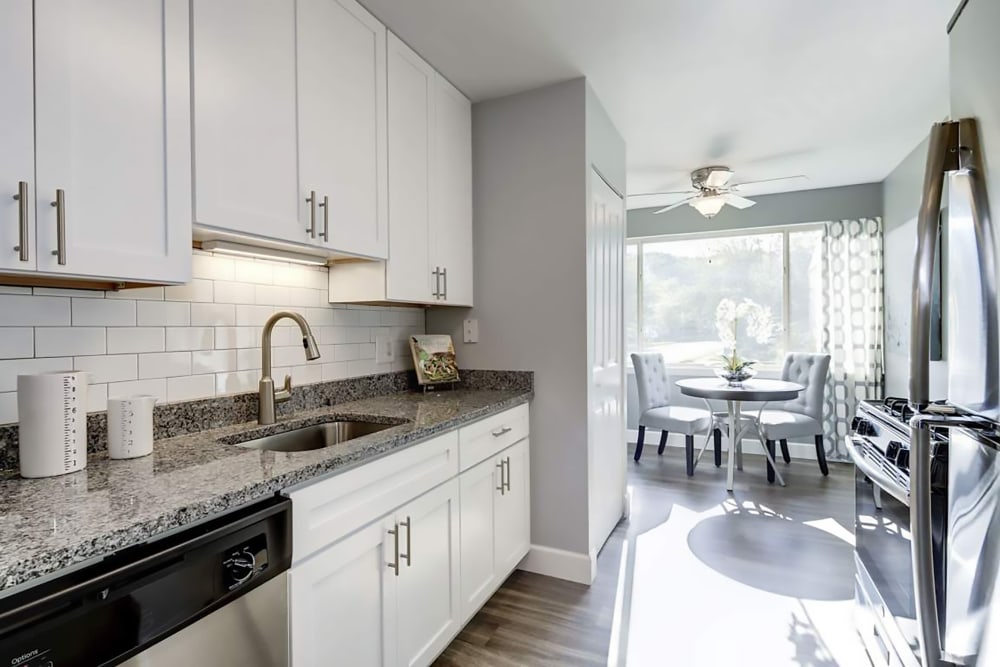 Kitchen and dining area at Satyr Hill Apartments in Parkville, Maryland