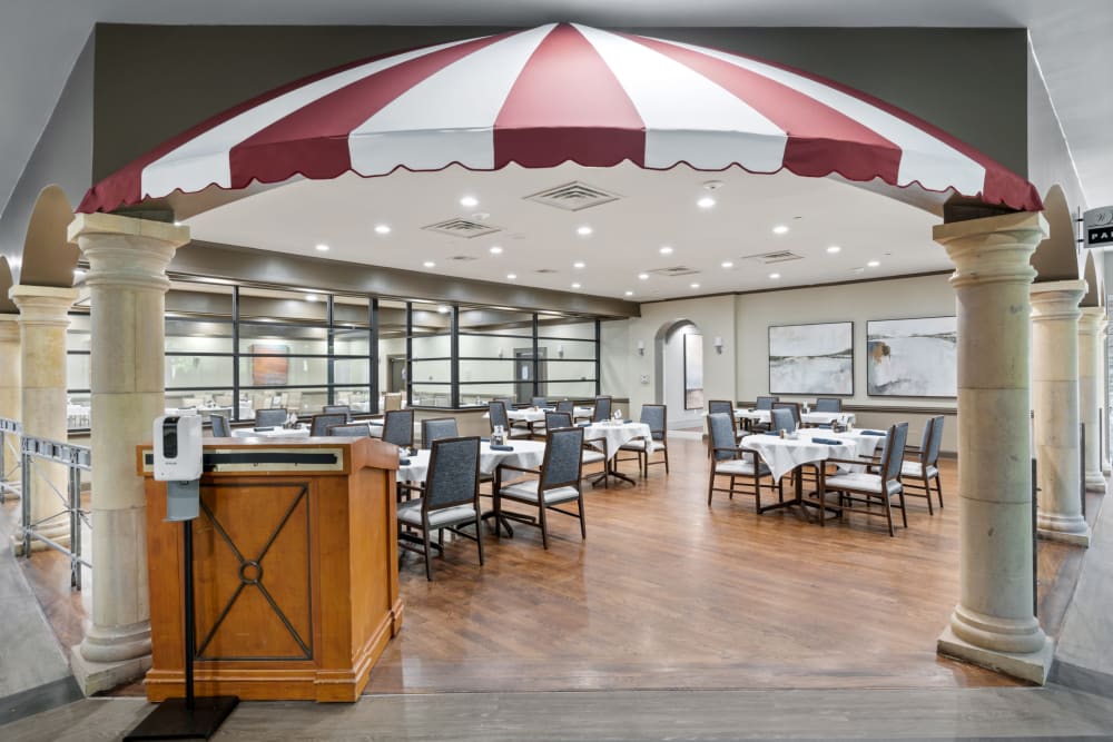 A large common dining room at Truewood by Merrill, Park Central in Dallas, Texas