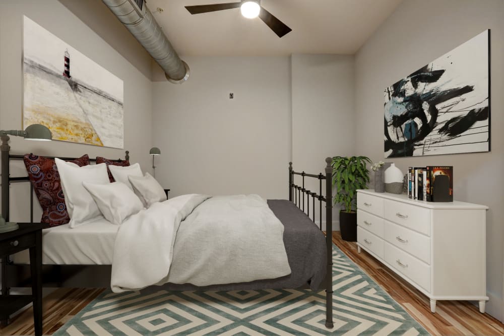 Modern bedroom with a ceiling fan at The 805W Lofts in Richmond, Virginia