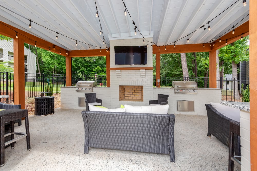 Outdoor lounge and barbecue area at Emerald Place in Durham, North Carolina