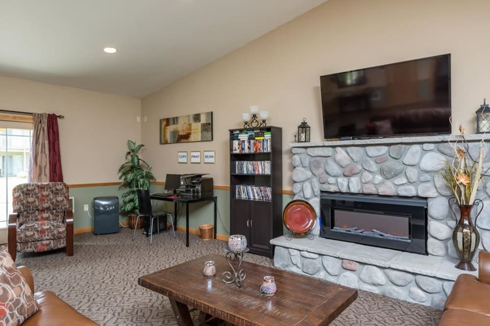 Cozy common area with a fireplace to stay warm when its cold outside at Gateway Village in Springfield, Oregon
