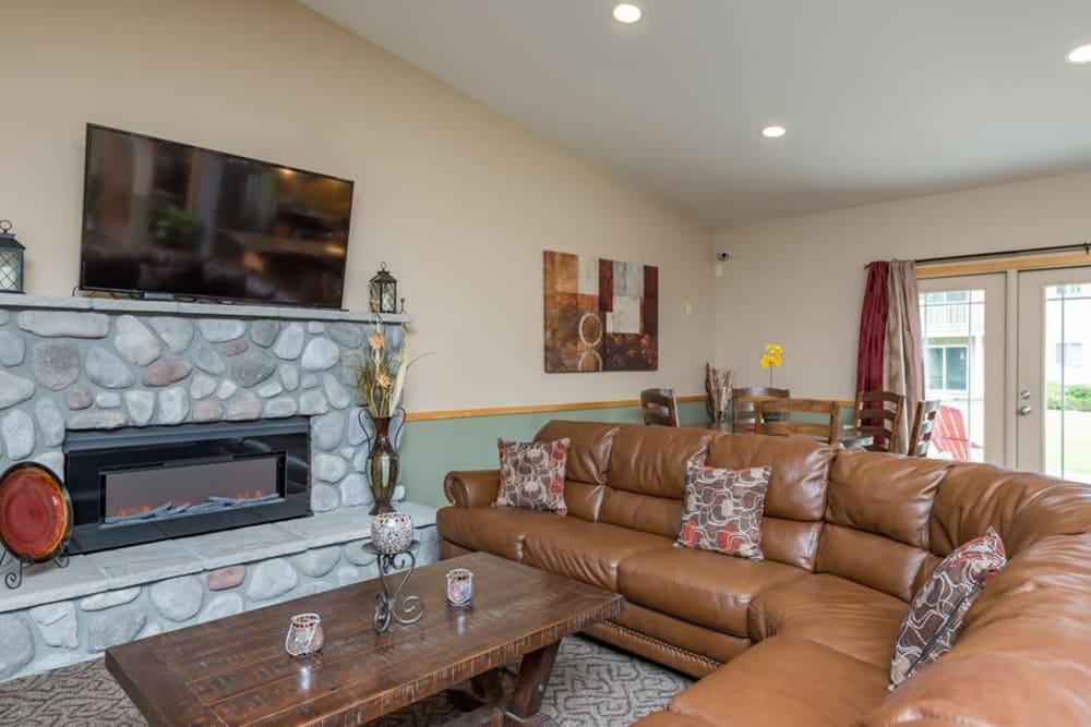 Clubhouse with huge couch and fireplace to stay warm in at Gateway Village in Springfield, Oregon